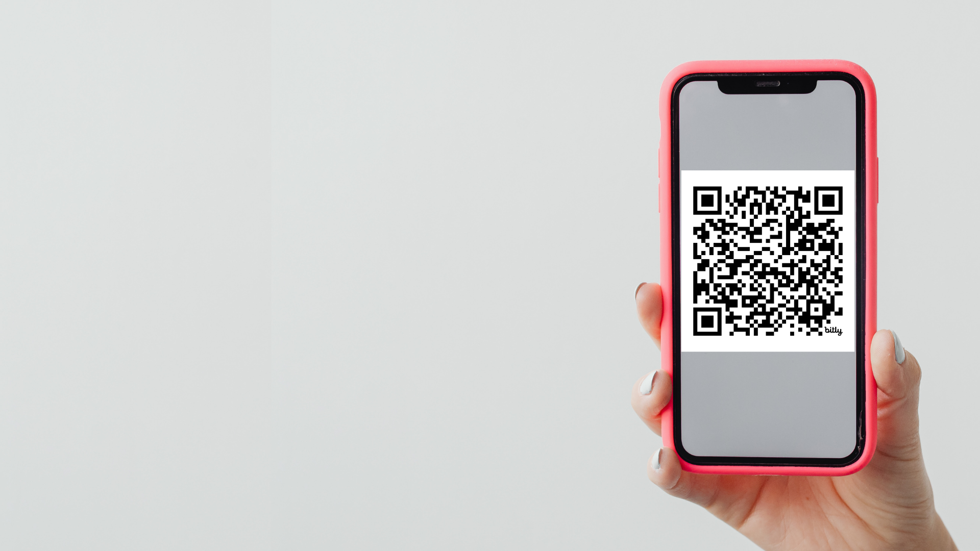 kuvituskuva, jossa puhelinta pitävä käsi